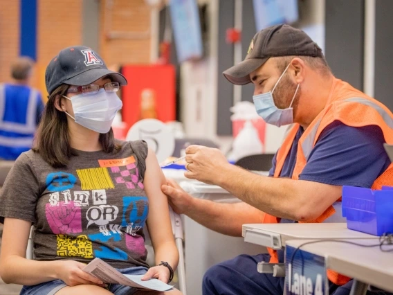 young woman getting vaccinated