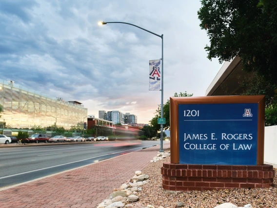 college of law sign with traffic blurring as it passes